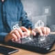 Office worker using computer connected to the cloud